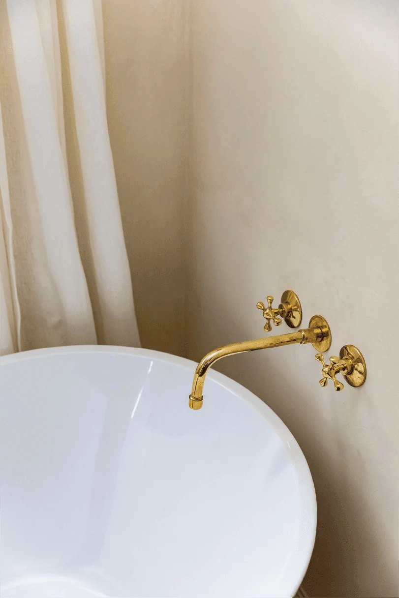 Freestanding tub with a brass faucet