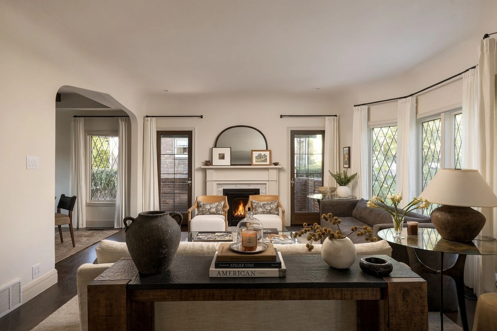 Living room with diamond-grid windows and fireplace