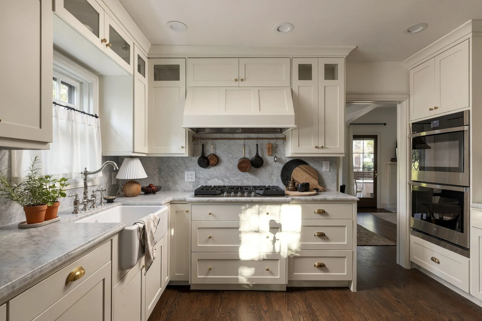 Restored kitchen with Carrara marble and brass hardware